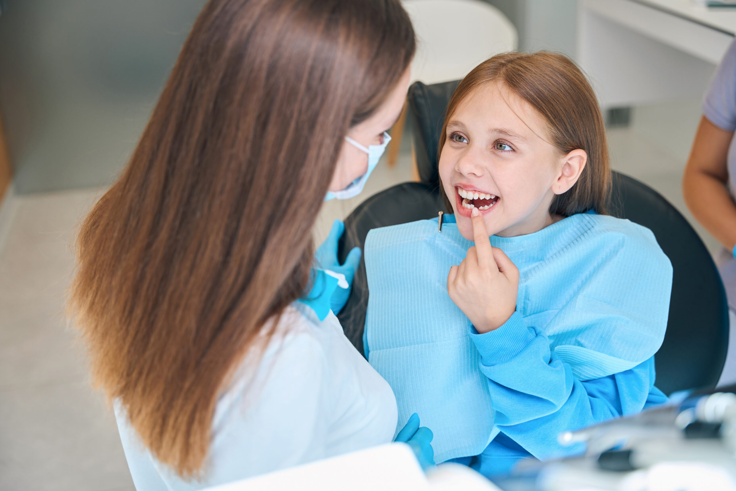 A young patient smiling during a pediatric dental checkup